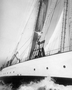 1943 --- Errol Flynn seen on his famous yacht climbing up the rigging during a cruise to Catalina Island. --- Image by © Underwood & Underwood/CORBIS